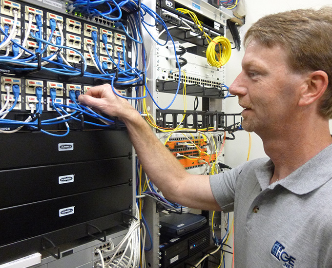 Telecom Engineer working in server room